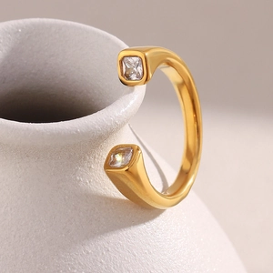 Detailed view of an 18K gold plated stainless steel ring with two square zircon stones
