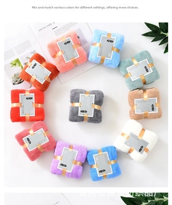 Detailed overhead view of premium thick coral fleece towel sets in multiple pastel colors