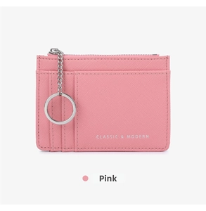 Pink crossgrain leather card holder with silver zipper, key ring, and card slots