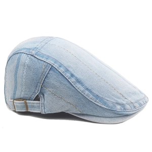 Detail of light blue denim ivy cap featuring contrast stitching and metal side buckle