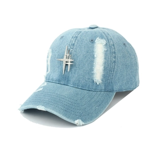Distressed light blue denim baseball cap with metallic cross star stud and ripped details