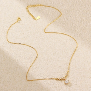 Close-up of S925 silver stamp on gold-plated zirconia necklace chain detail