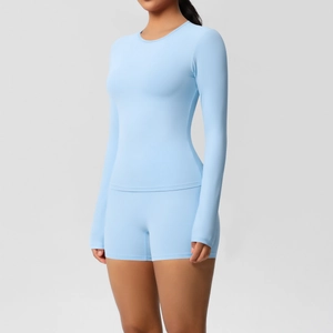 Close-up showing the stretch fit and seamless texture of this blue yoga two-piece set