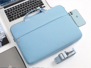 Light blue waterproof laptop sleeve with reinforced handles and detachable shoulder strap