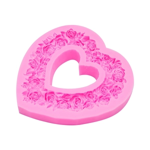 Pink heart-shaped silicone mold with rose flower patterns for cake decorating and crafts
