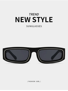 Detail view of black small frame sunglasses with silver metal trim and dark grey lenses