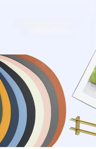 Macro shot of circular PU leather placemats with lychee texture in assorted colors