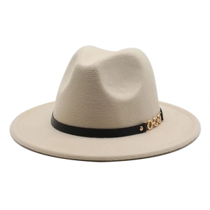 Detail of beige wool fedora hat featuring a black belt strap and gold chain buckle accent