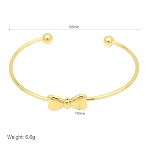 Detail view of 18k gold plated bow bangle showing 68mm diameter and 10mm height