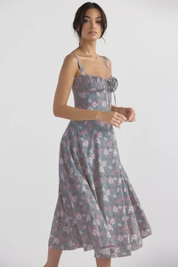 Detailed view of floral print midi dress featuring corset bodice and drawstring bow