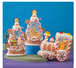 Close-up of LED Christmas water lantern with gingerbread man and santa claus design