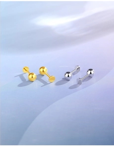 Detailed view of minimalist gold and silver S925 sterling silver ball stud earrings