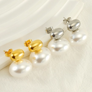 French vintage titanium steel pearl earrings in gold and silver finish on wave texture