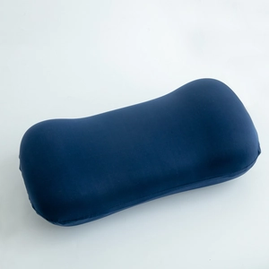 Ergonomic memory foam waist pillow with dark blue knit fabric and wave curve design