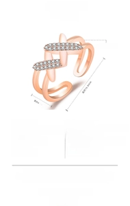 Detail of minimalist rose gold hollow ring featuring pavé set sparkling stones