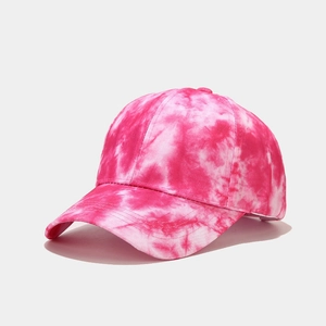 Detailed view of pink tie-dye pattern and stitching on a stylish baseball cap