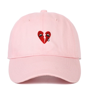 Pink cotton baseball cap with red broken heart embroidery and street style design