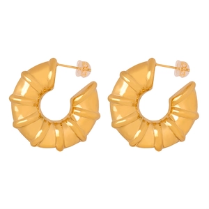 Golden C-shaped earrings with bamboo-inspired texture and chunky ribbed finish