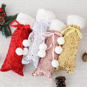 Sequin Christmas wine bottle covers in red, silver, gold with white faux fur and plush pom-poms