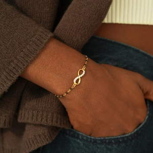 S925 sterling silver infinity bracelet with white zircon and black beads on wrist