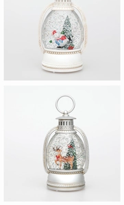 Detail of Christmas lantern snow globe with snowman, reindeer and swirling silver glitter