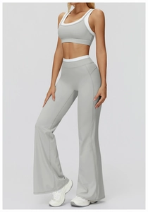Detail of light grey ribbed yoga set featuring flared high waist pants and sports tank top