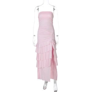 Detail of pink strapless ruffled layered dress with high slit on transparent mannequin