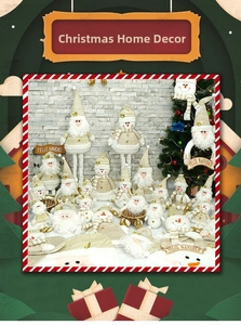 Detail of knitted Christmas gnomes and snowmen in cream and gold festive home decor