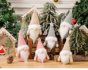 Detailed arrangement of six knitted Christmas gnomes with stars in a festive snowy scene
