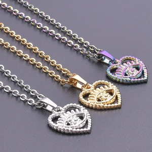 Detail view of heart-shaped eye pendants in silver, gold and rainbow finishes