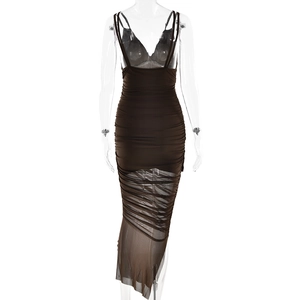 Detail of sheer brown mesh bodice and ruched skirt design on asymmetrical evening dress