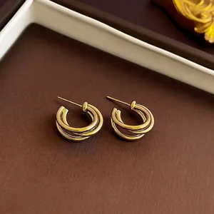 Elegant triple-layered interwoven gold earrings with a high-polish 18K finish