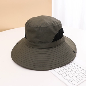 Detail of wide-brim sun hat featuring breathable mesh panels and durable snap buttons