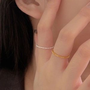 Close-up of model wearing minimalist silver twisted rope ring for a delicate daily look