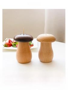 Detail of mushroom wood toothpick holders showing natural grain and top discharge holes