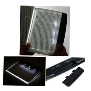 Detail showing the battery compartment and night use of the portable LED book reading light