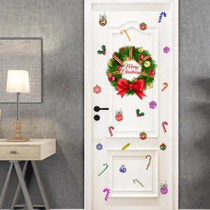 Christmas wreath and candy cane wall stickers on a white door for holiday home decor