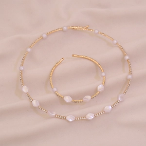 Minimalist gold finish necklace and bracelet set with pearls and zircons for women