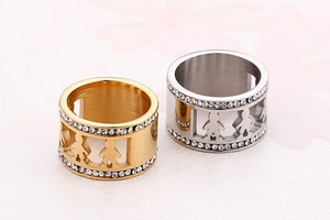 Detail view of hollow boy and girl silhouette rings with crystal zircon accents
