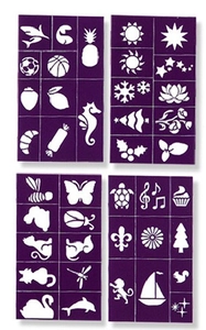 Detail view of 4 purple plastic hollow tattoo stencils with various animal and plant patterns