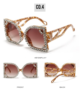 Detail view of oversized tortoise square sunglasses with rhinestones and cutout temples
