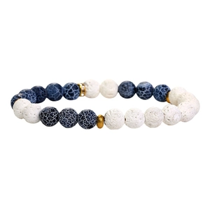 Handmade beaded bracelet featuring white lava stone, blue dragon agate and gold accents