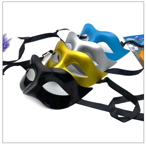 Detail view of four semi-face masks in black, gold, silver, and blue with satin ribbons