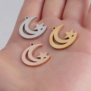Size reference of silver, gold and rose gold hollow crescent and star charms in hand