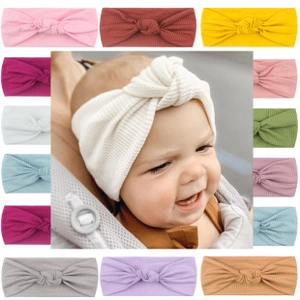 Detailed view of ribbed knit baby headbands with knot bows in 13 assorted candy colors