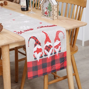 Christmas burlap table runner with faceless gnomes on wooden table for holiday decor