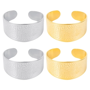 Detailed set of four wide C-shaped stainless steel cuffs with hammered texture design