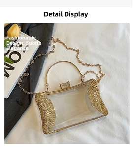 Detailed macro view of clear acrylic evening bag with gold rhinestones and metal ring handle