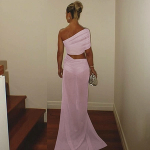 Detail view of the back of a pink mesh patchwork off-shoulder crop top and maxi skirt set