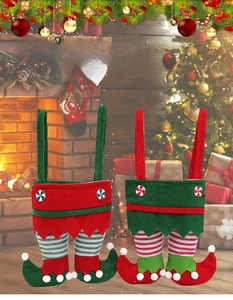 Detailed view of Christmas elf pants gift bags with festive felt straps and stripe patterns
